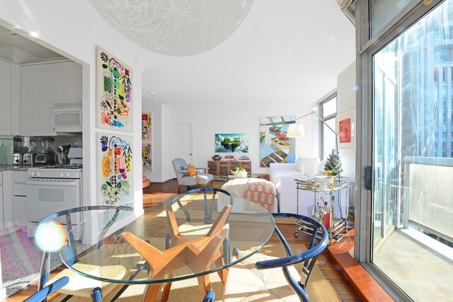 188 E 64th St Unit 1702, New York City, NY 10065 - dining room featuring wood finished floors