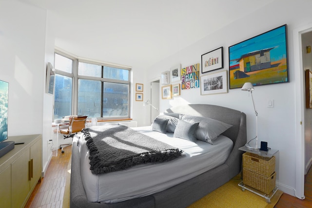 bedroom with wood finished floors