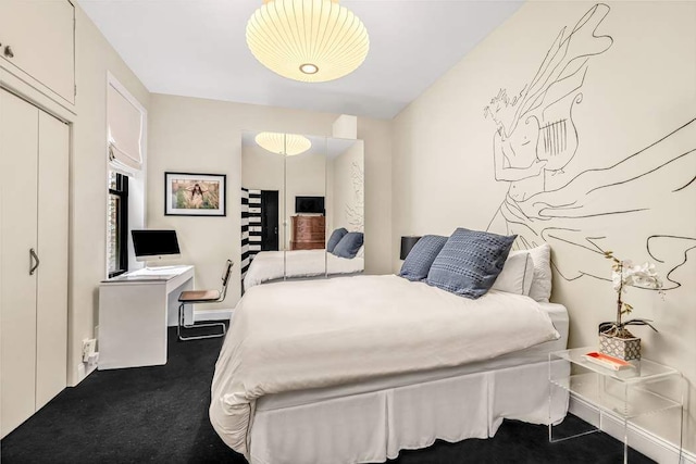 bedroom featuring dark colored carpet