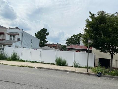 view of road with sidewalks and curbs