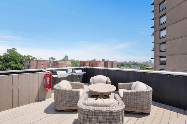 wooden terrace featuring a city view