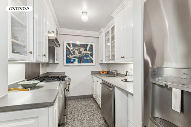 225 E 57th St Unit 7G, New York City, NY 10022 - kitchen with stainless steel appliances, range hood, a sink, white cabinetry, and crown molding