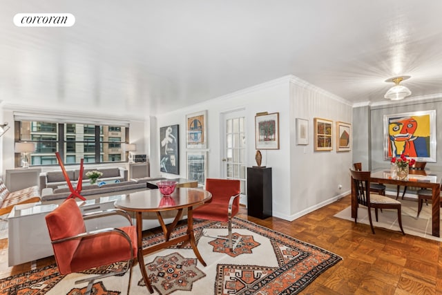 living room with dark parquet floors and ornamental molding