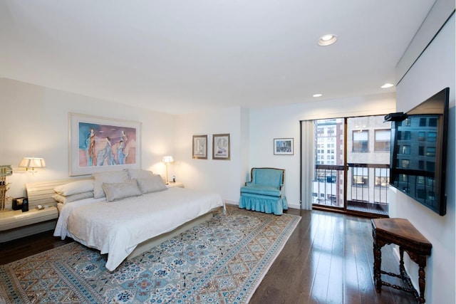 bedroom with dark wood-type flooring and access to exterior