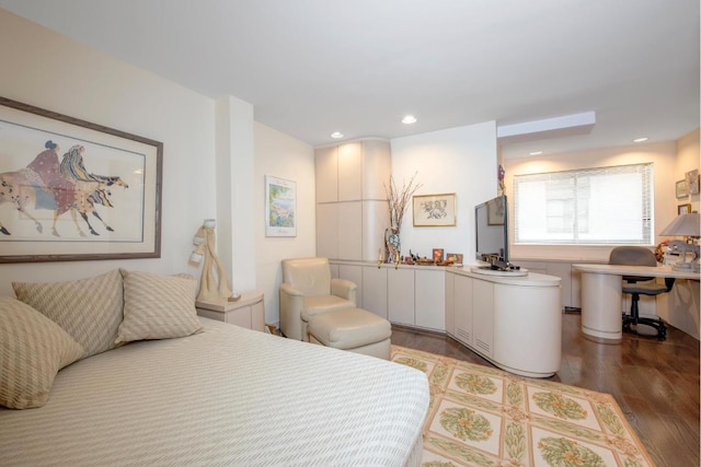 bedroom with hardwood / wood-style floors