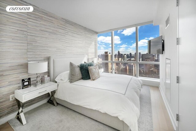 bedroom with light wood-type flooring