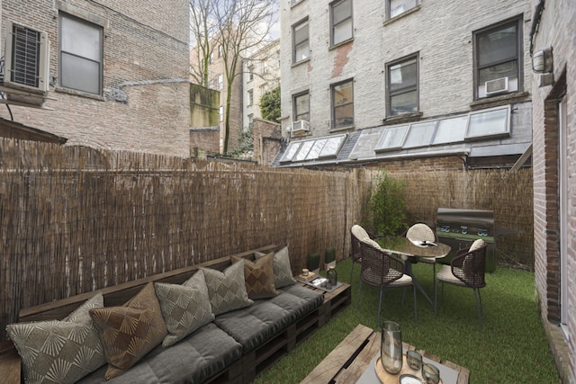 view of patio with area for grilling and outdoor lounge area