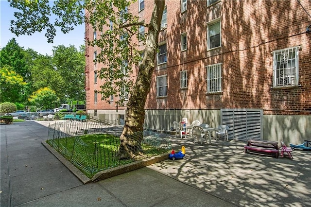 221 Mcdonald Ave Unit P3, New York City, NY 11218 - view of property exterior with brick siding and a patio