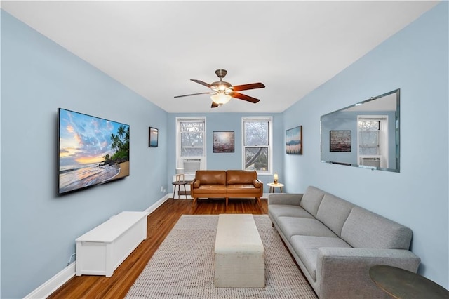 living room featuring ceiling fan and wood-type flooring