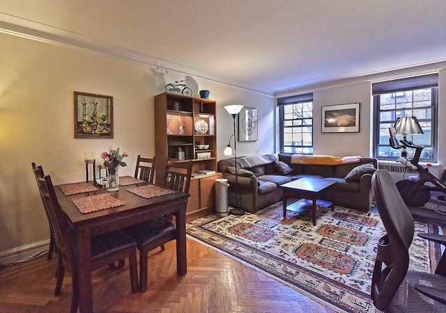 dining area with crown molding