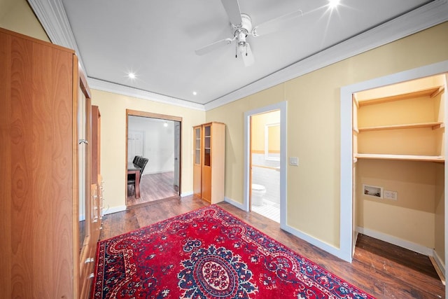 hallway with ornamental molding and hardwood / wood-style floors