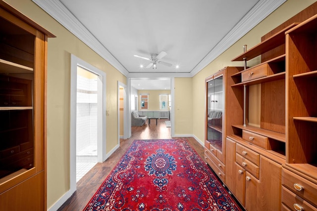 interior space featuring dark hardwood / wood-style flooring and ornamental molding