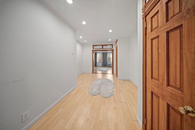 corridor with light hardwood / wood-style flooring