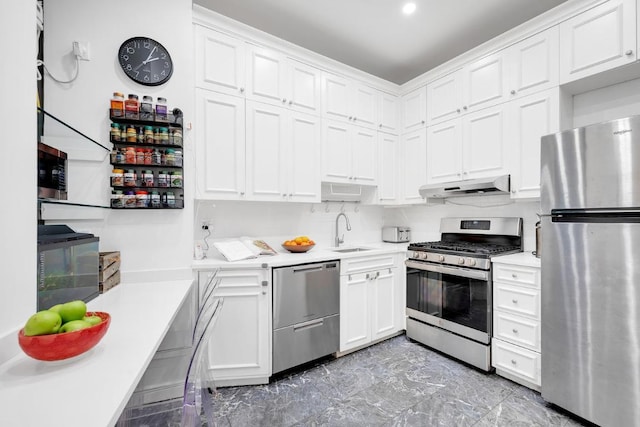 kitchen with white cabinetry, backsplash, sink, and stainless steel appliances