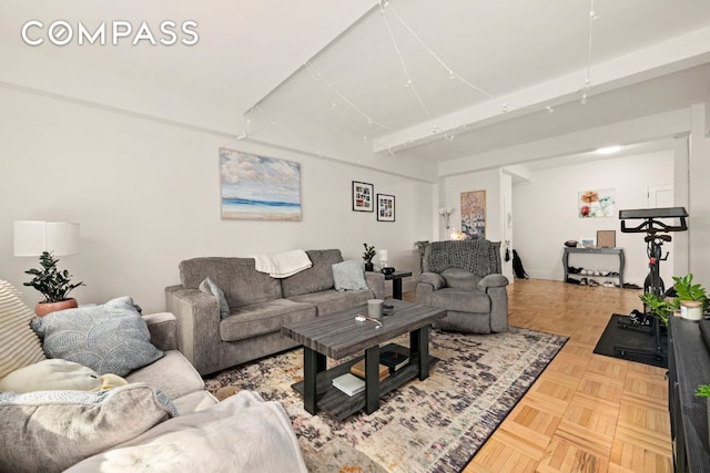 living room with parquet flooring and beam ceiling