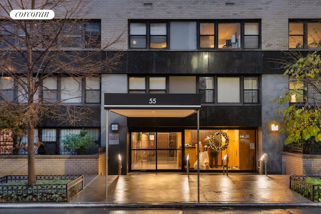 entrance to property with brick siding