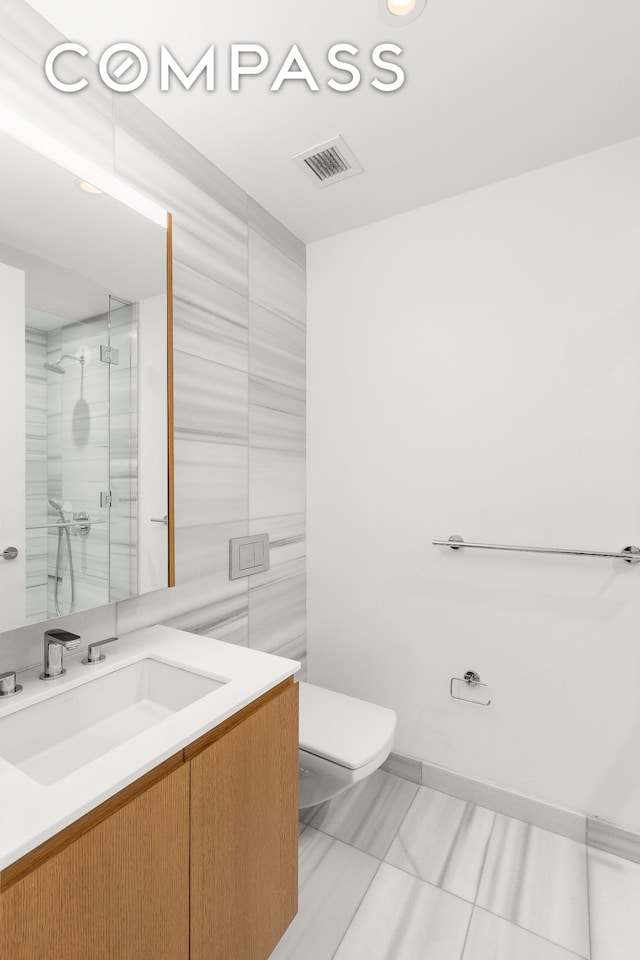 50 W St Unit 14B, New York City, NY 10006 - full bath with a shower stall, vanity, toilet, recessed lighting, and tile walls