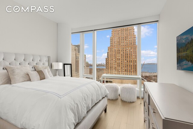 50 W St Unit 14B, New York City, NY 10006 - bedroom featuring light wood-type flooring