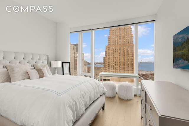50 W St Unit 14B, New York City, NY 10006 - bedroom featuring light wood-type flooring