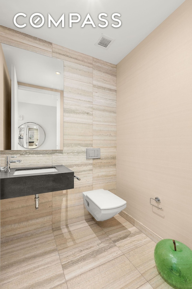 50 W St Unit 14B, New York City, NY 10006 - half bathroom featuring toilet