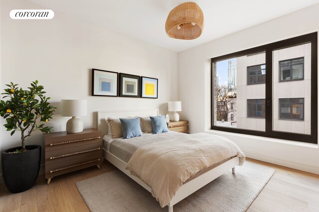 bedroom with light hardwood / wood-style flooring