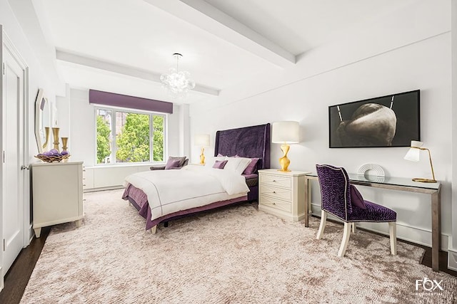 bedroom featuring beam ceiling, a notable chandelier, and wood finished floors