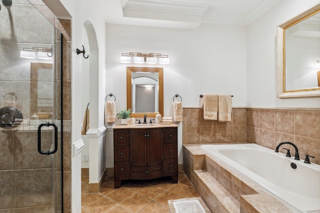 bathroom with a bath, ornamental molding, vanity, tile patterned flooring, and a stall shower