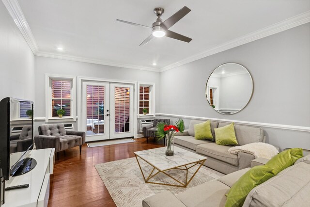 living area featuring crown molding, french doors, ceiling fan, and wood finished floors