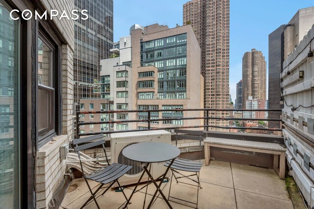 balcony featuring a view of city