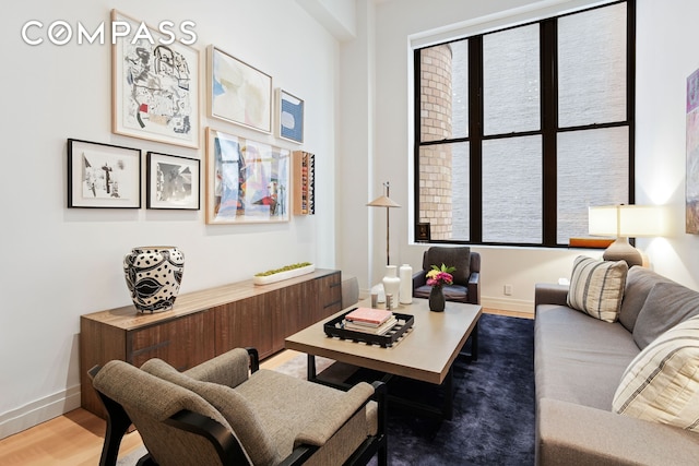living room with wood finished floors and baseboards