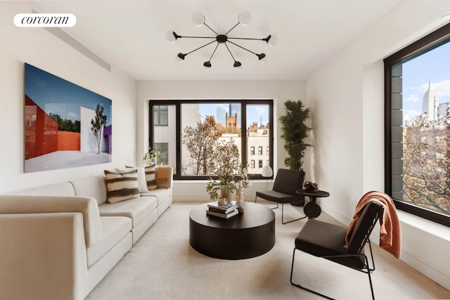 living room with an inviting chandelier and plenty of natural light