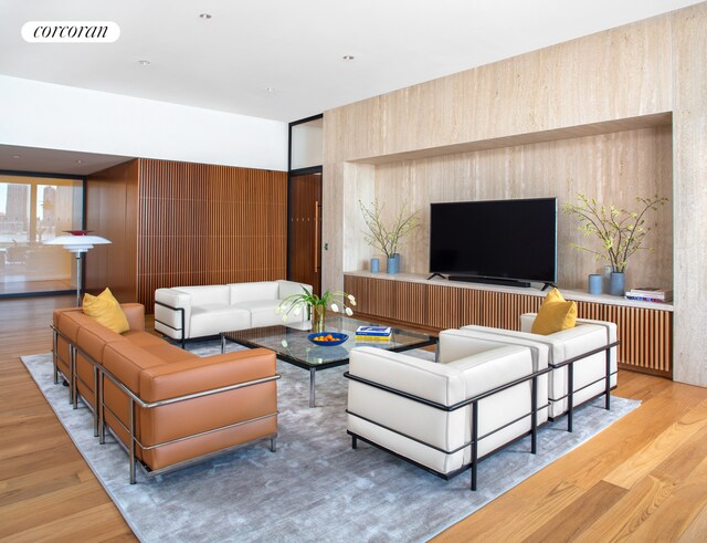 bedroom featuring floor to ceiling windows and hardwood / wood-style floors