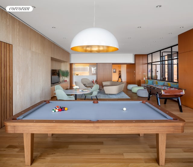 recreation room with pool table and light hardwood / wood-style floors