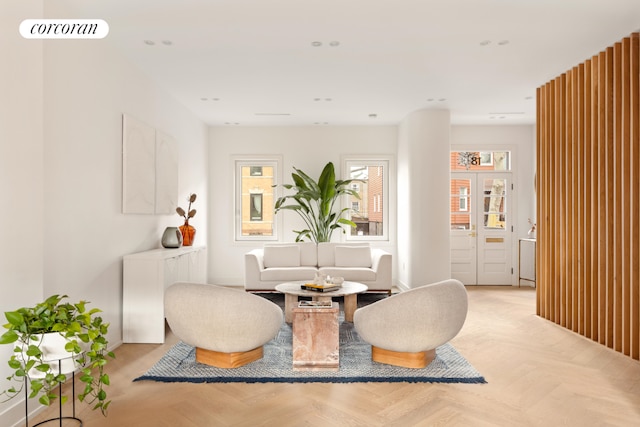 living area featuring light parquet flooring