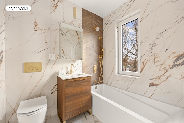 full bath with toilet, a garden tub, marble finish floor, stone wall, and a wealth of natural light