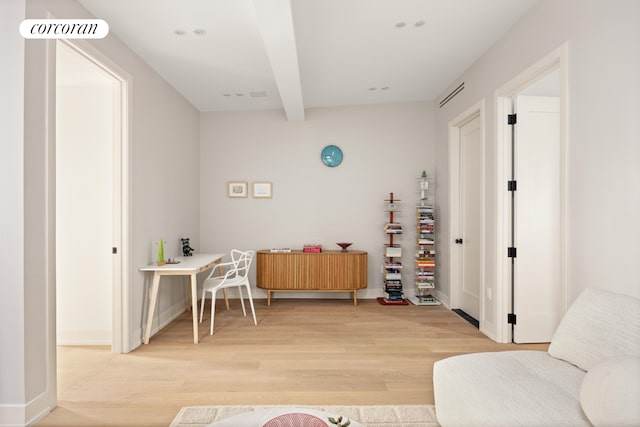 office with visible vents, beam ceiling, baseboards, and wood finished floors