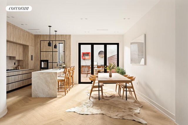 sitting room with light hardwood / wood-style flooring