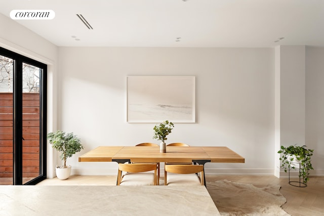 dining space featuring visible vents and baseboards