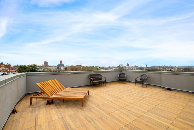 view of patio / terrace with a balcony and a city view