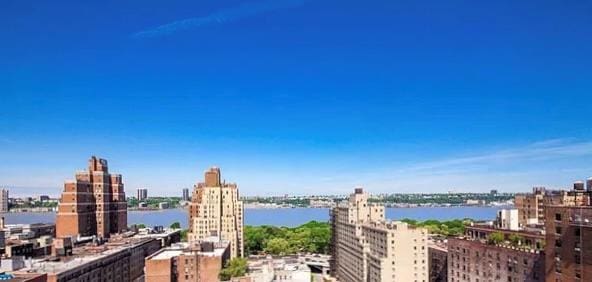 property's view of city featuring a water view