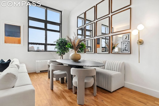 dining space with a wealth of natural light and light hardwood / wood-style floors