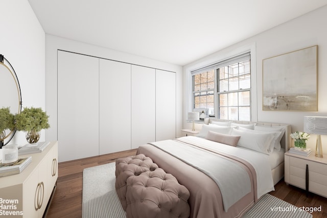 bedroom featuring a closet and dark wood finished floors