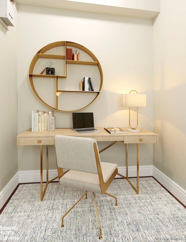 home office featuring baseboards and wood finished floors