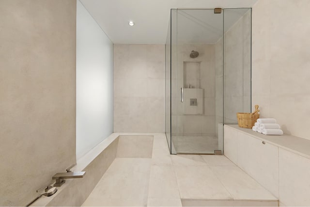 full bathroom featuring a walk in shower and tile patterned floors