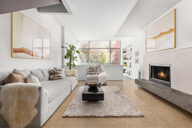 tiled living room featuring a warm lit fireplace and built in shelves