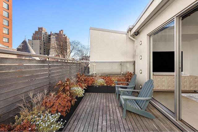 balcony featuring a city view