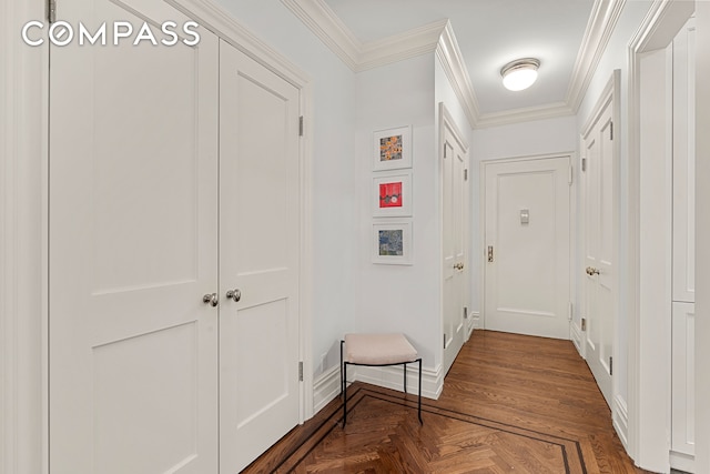 hallway featuring crown molding and baseboards