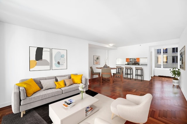 living room featuring dark parquet floors