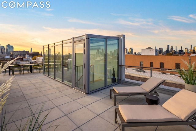 view of patio terrace at dusk