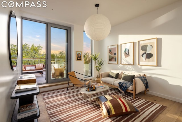 sitting room with hardwood / wood-style flooring